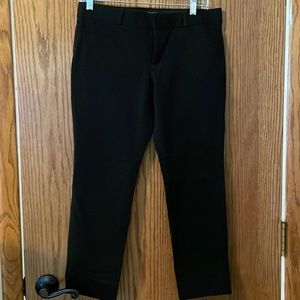 Banana Republic black pants. Small white mark on back of pant leg. See photo.